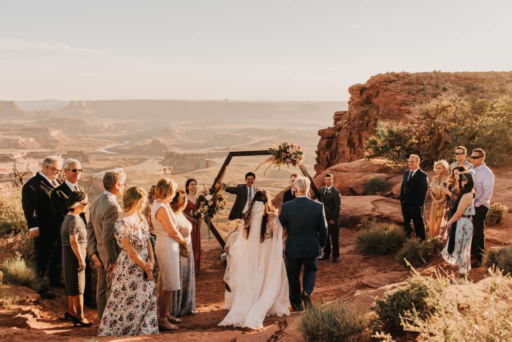 dad walking the bride down the aisle in Canyonlands National Park