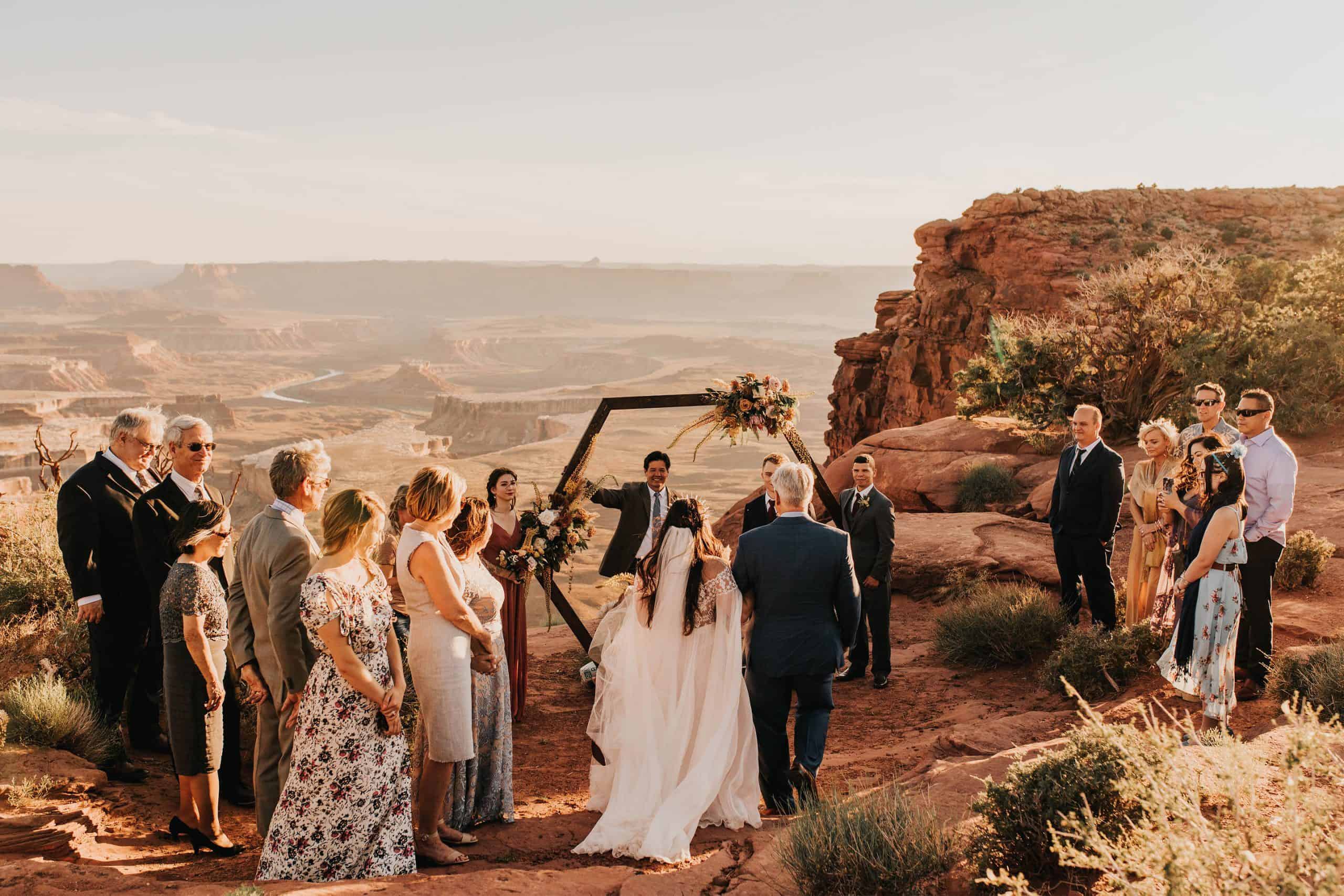 dad walking the eloping bride down the aisle in Canyonlands National Park