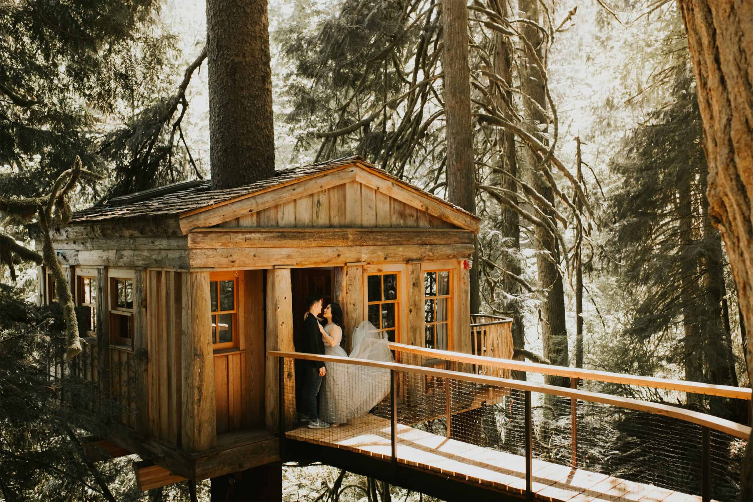 sweethearts embrace at TreeHouse Point in Issaquah, Washington