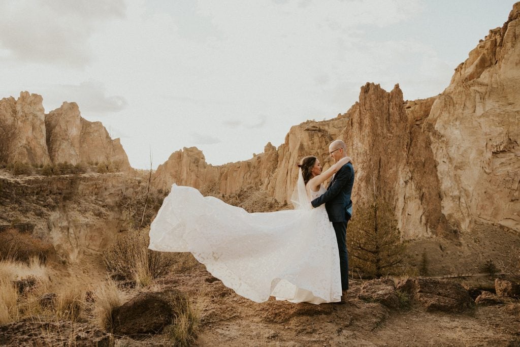bride and groom in the desert