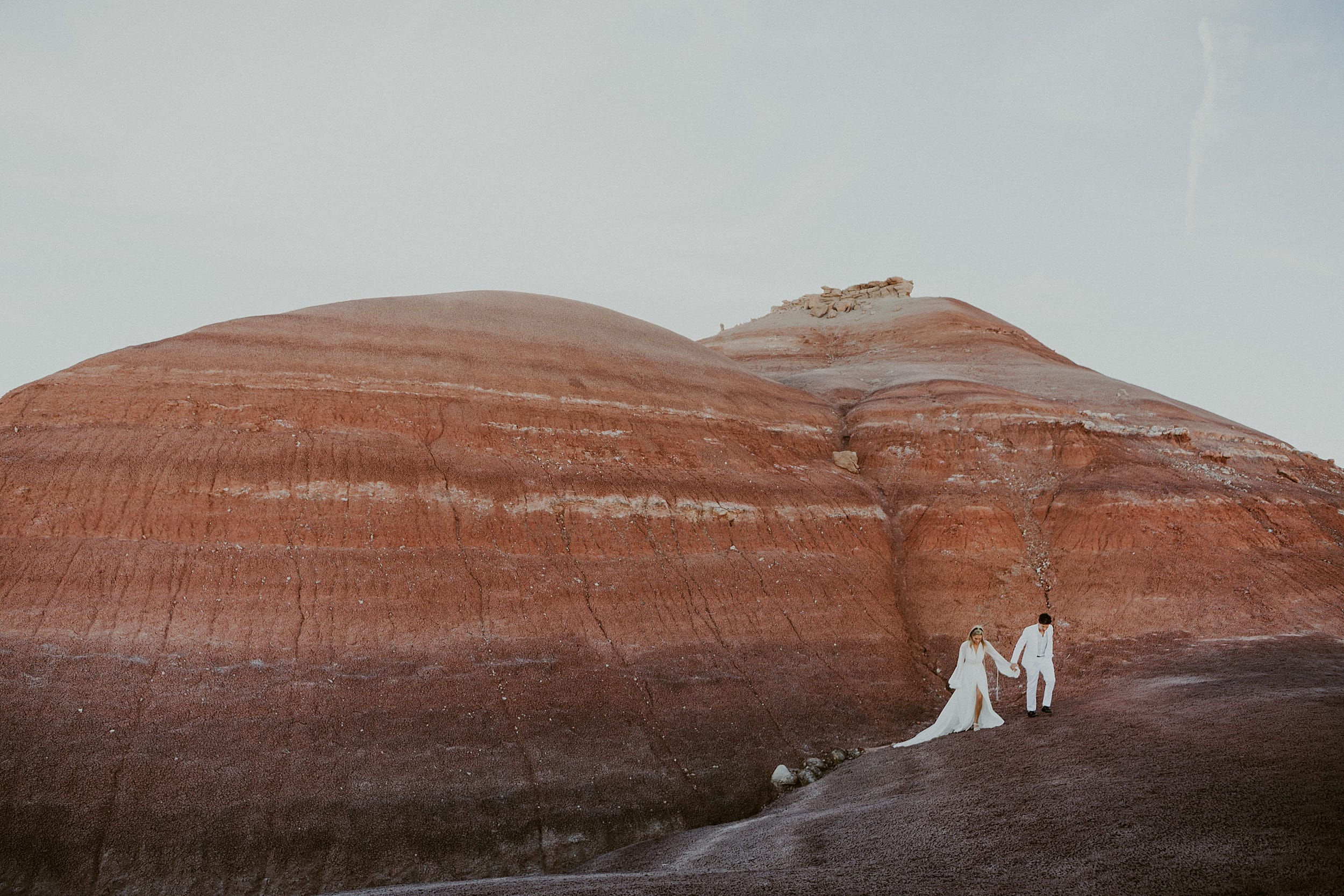 couple standing together hill landscape