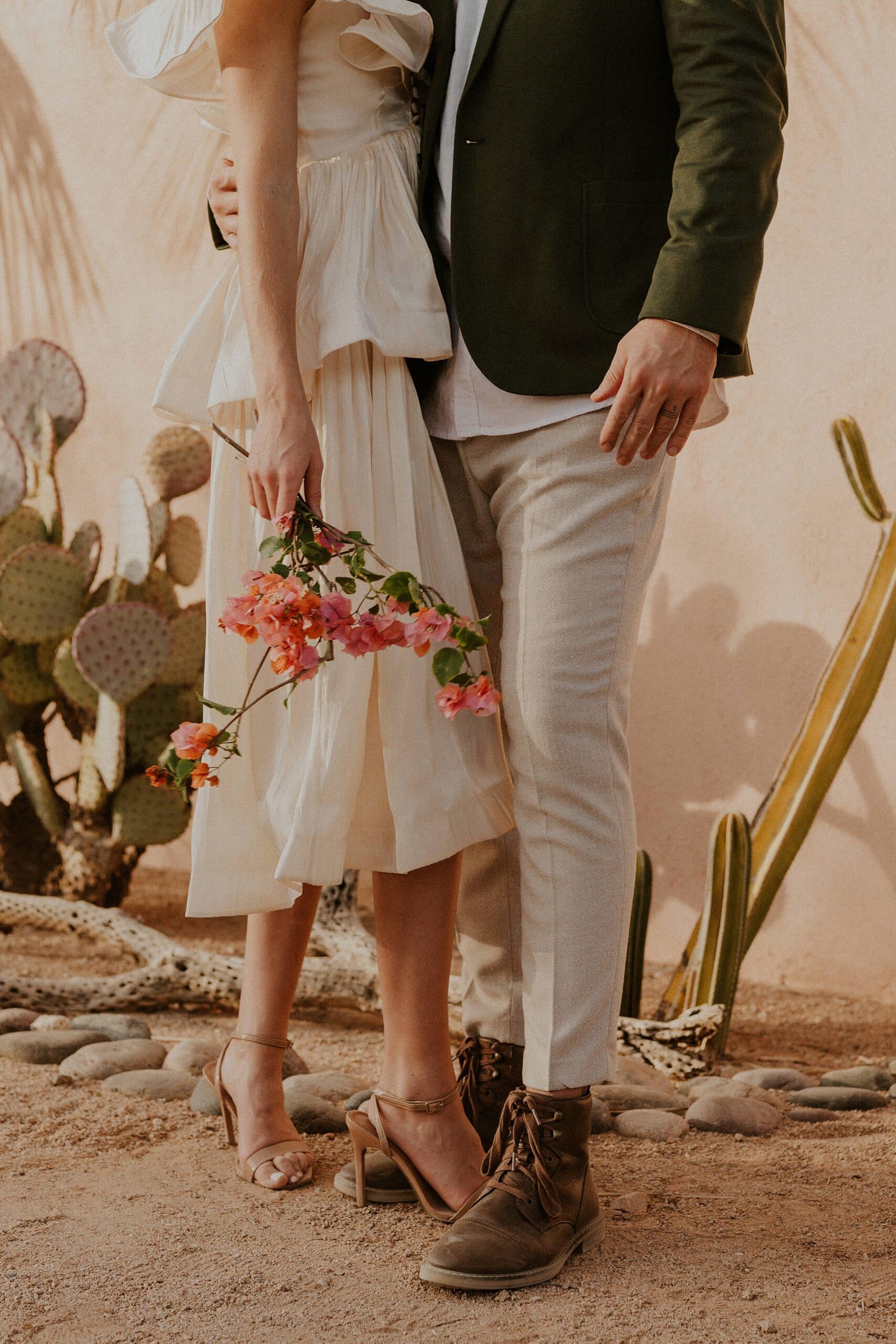 bride and groom outfit and flowers