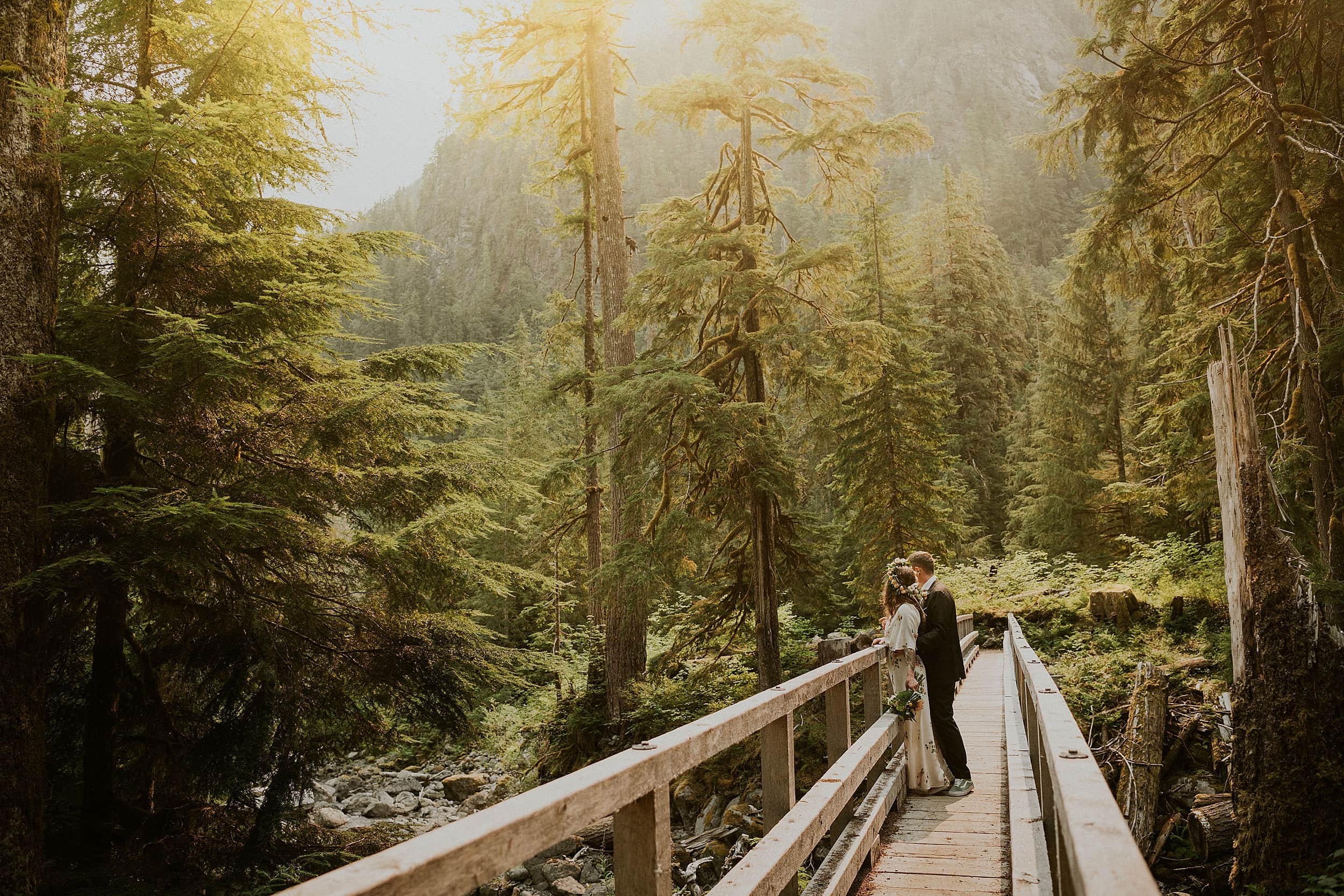 bride and groom on bridge mount hood wilderness landscape
