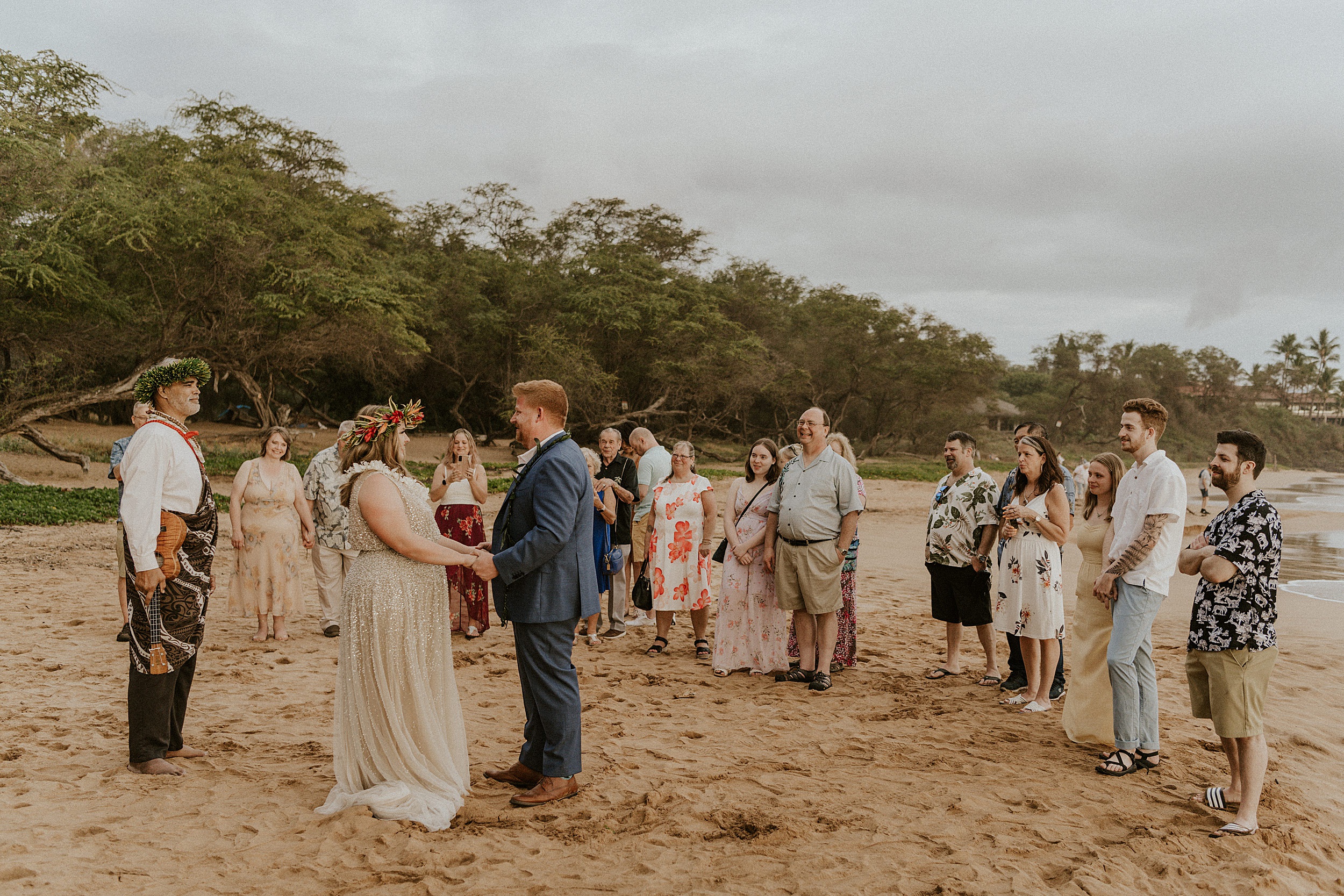 couple getting married on beach in hawaii