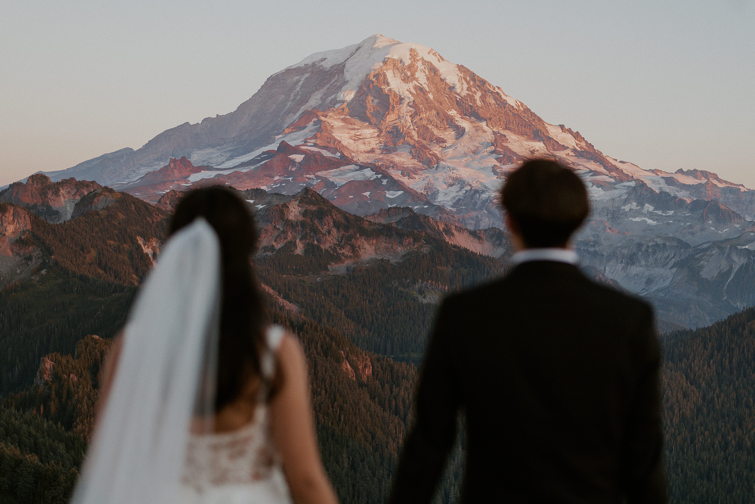couple looking at mountain with alpenglow