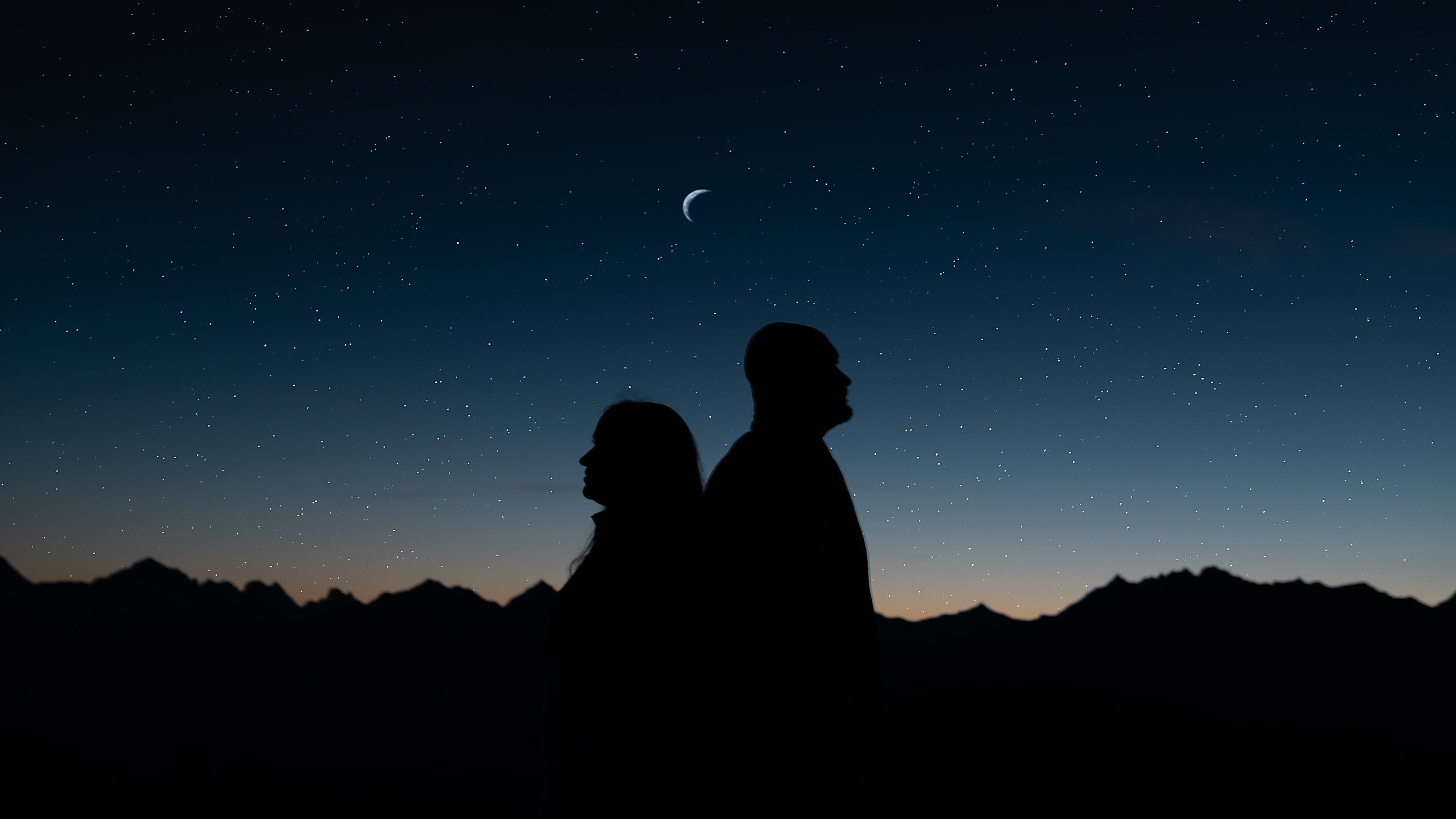 couple standing under the stars